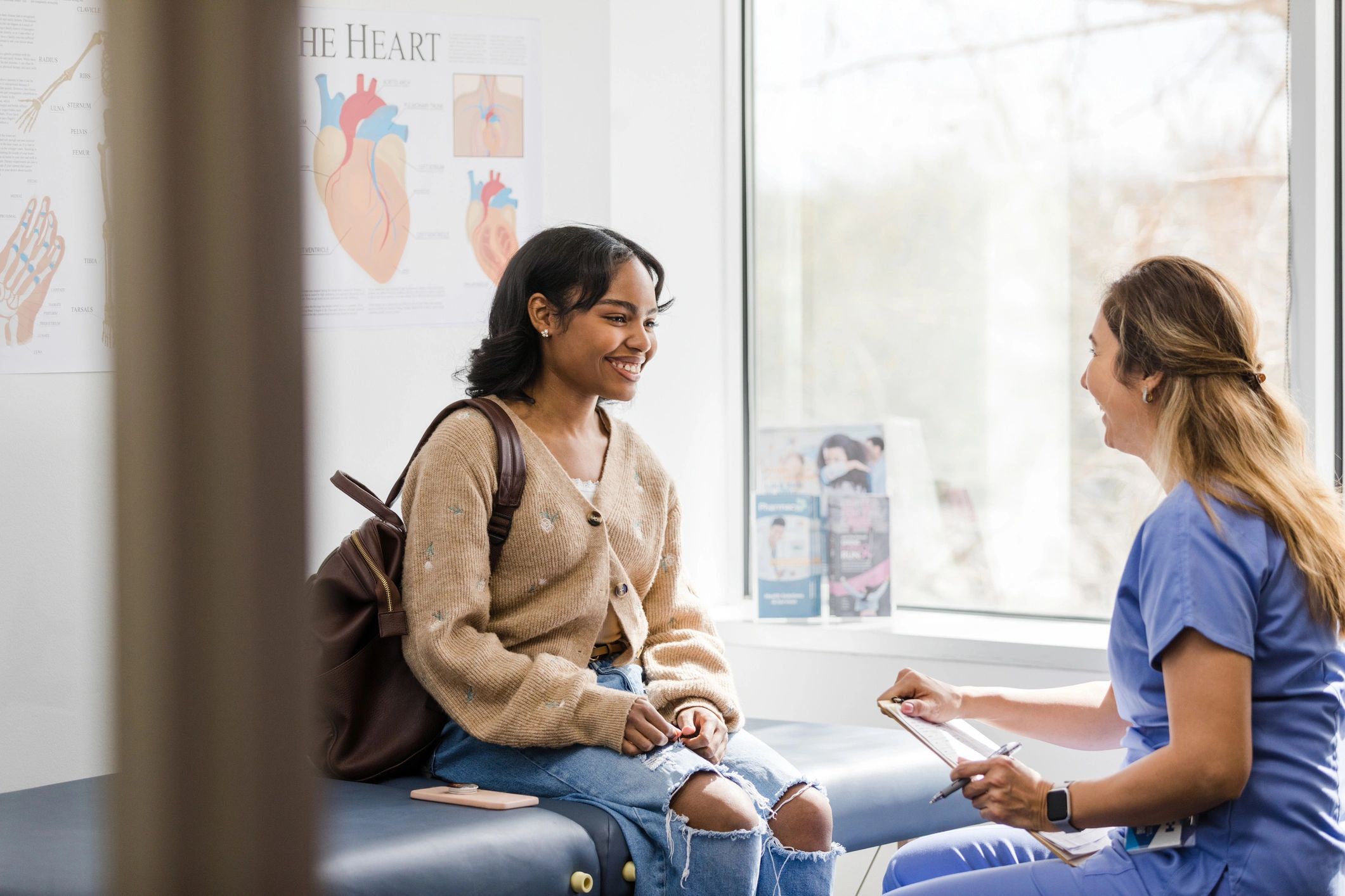 Dental clinician speaking with a patient during a consultation.