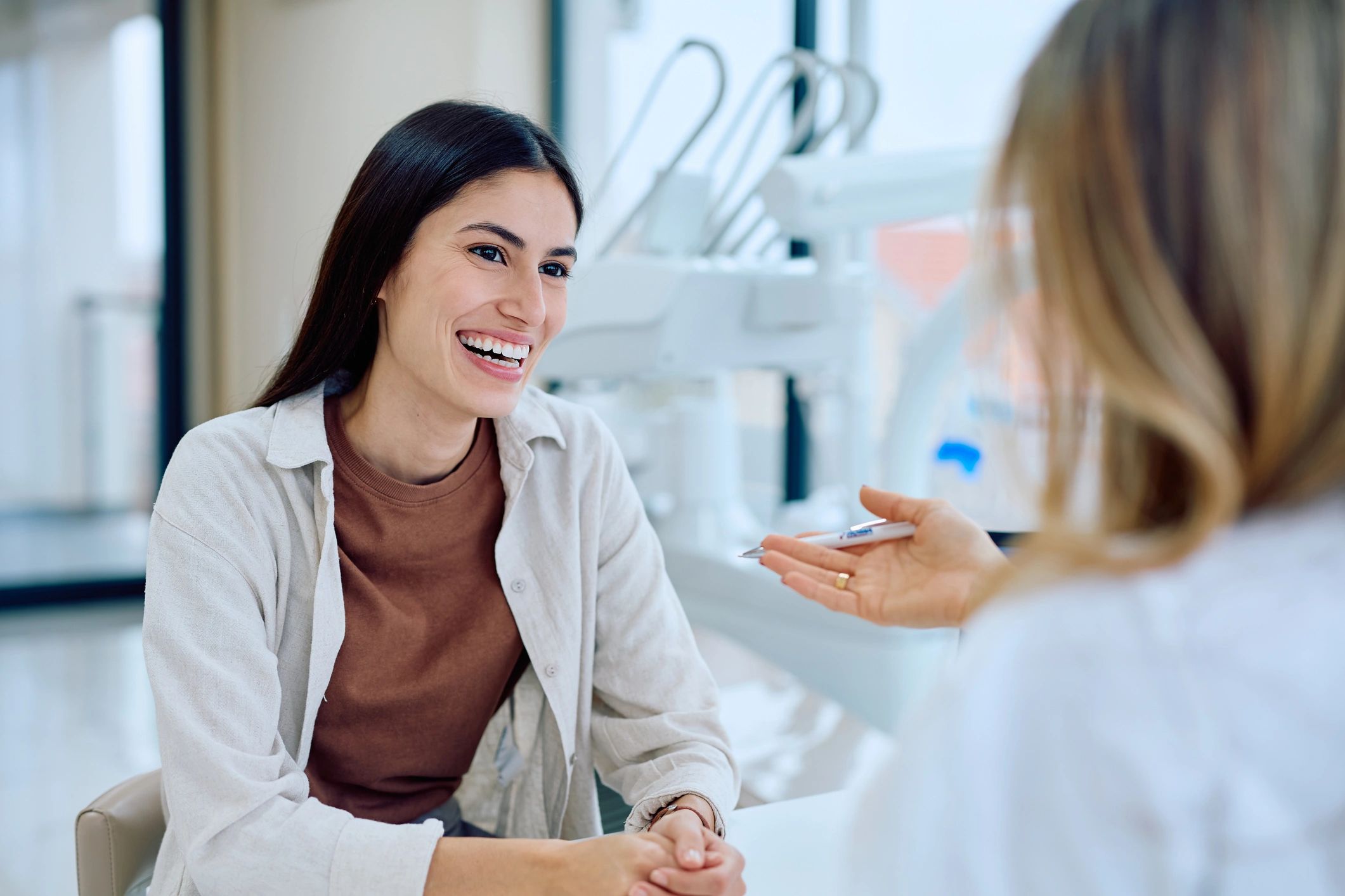 Warm consultation scene in a modern dental clinic