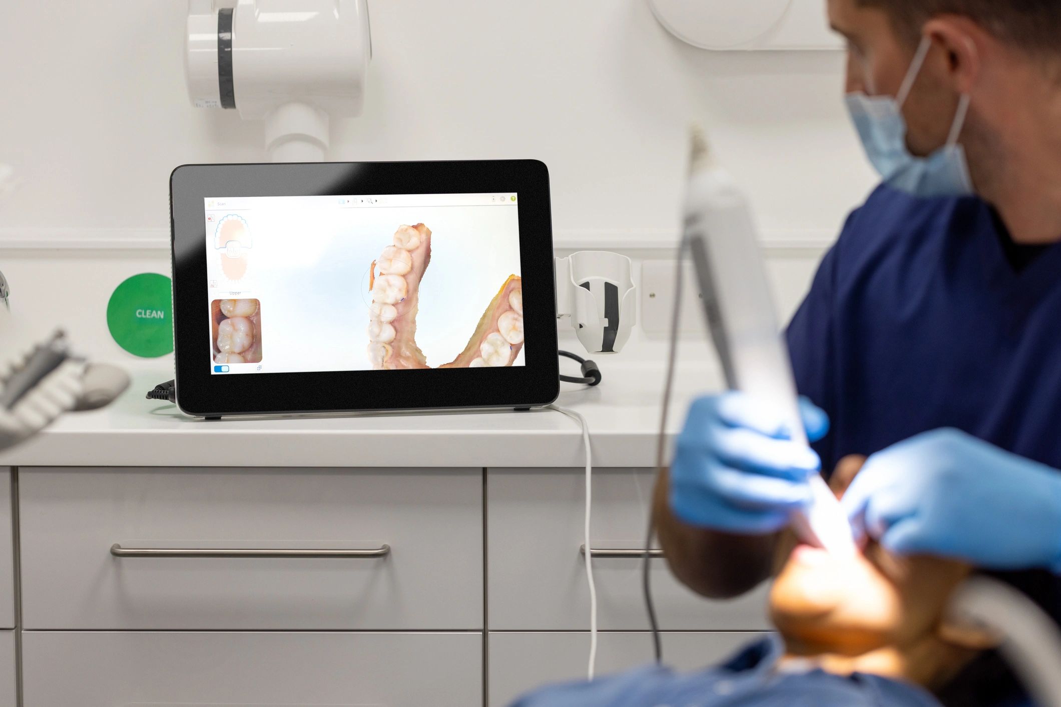 Dentist using an intraoral scanner during a check-up